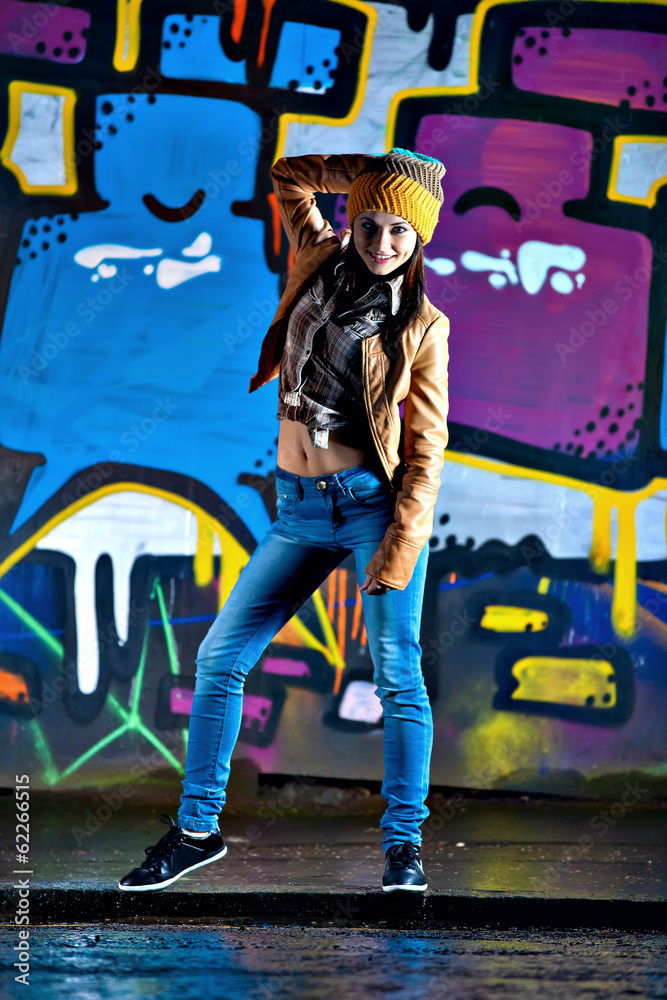 Pretty young girl and graffiti