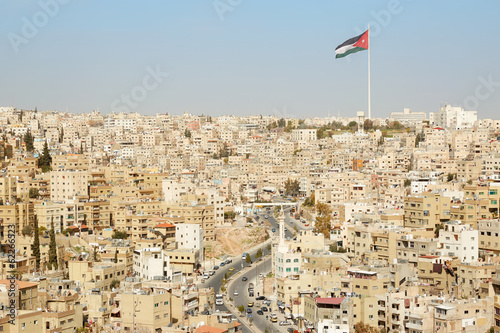 Amman city view with big Jordan flag