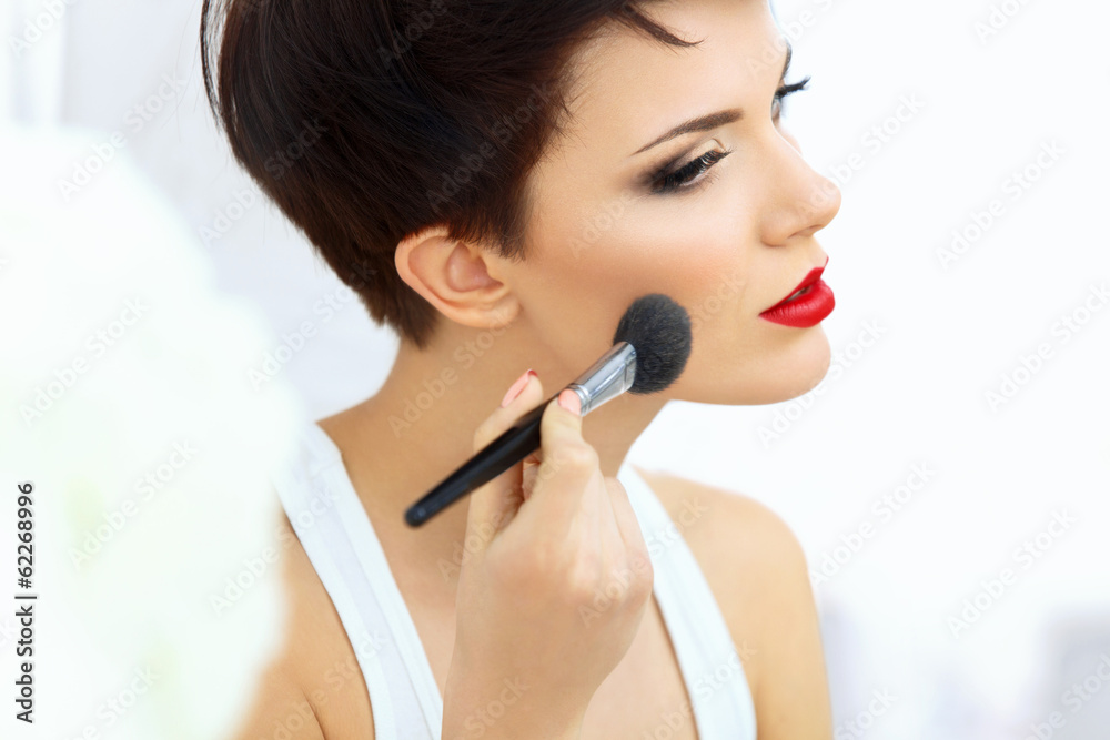 Beauty Girl with Makeup Brush and Red Lips. Beauty Girl with Makeup Brush and Red Lips.