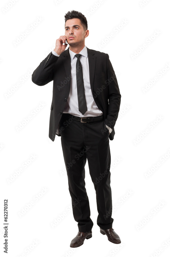 Modern business man answering on his iphone Modern business man answering on his iphone