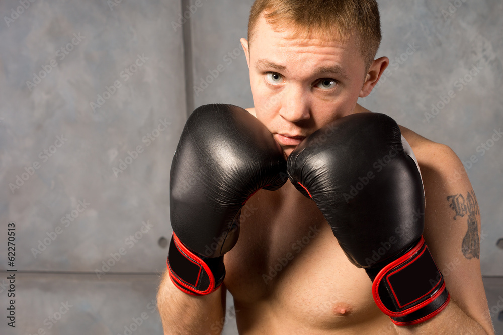 Boxer with his gloved fists raised defensively