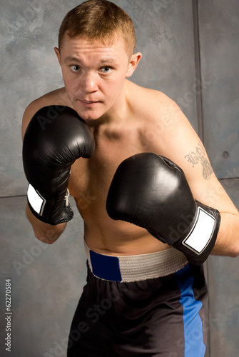 Professional young boxer in a fight © kolotype