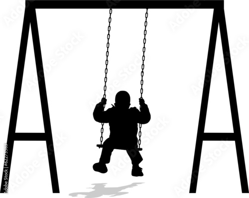 boy swinging at the park in winter jacket