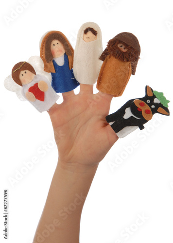 Nativity puppets on a child's hand.