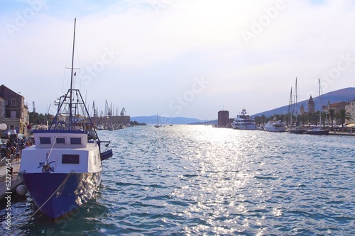 Harbor with ships and vanishing point over water in Croatia