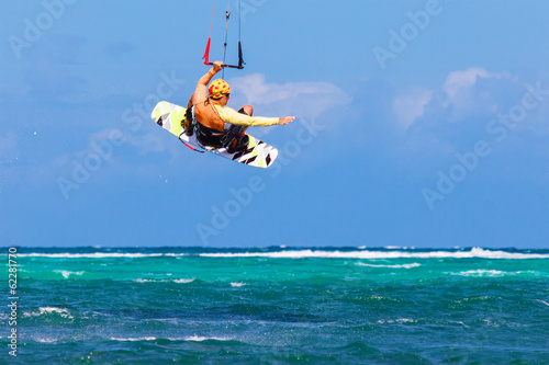 young kitesurfer on sea background Extreme Sport Kitesurfing