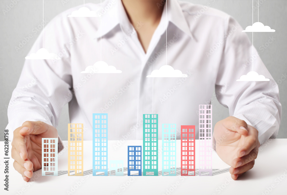 Building in hand businessmen Building in hand businessmen