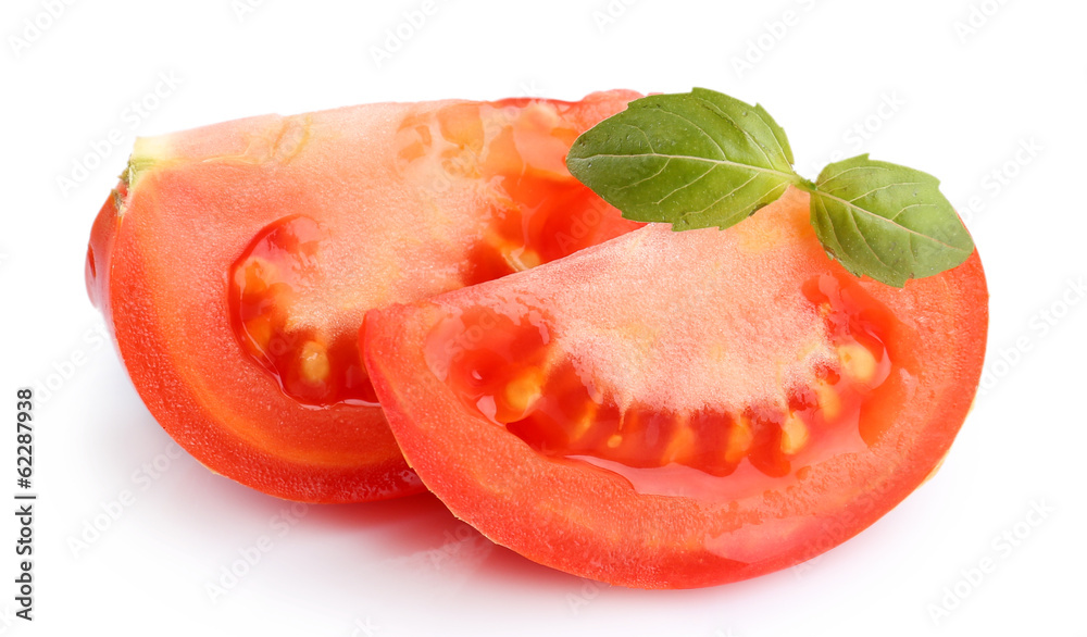 Slices of fresh tomato with basil, isolated on white Slices of fresh tomato with basil, isolated on white