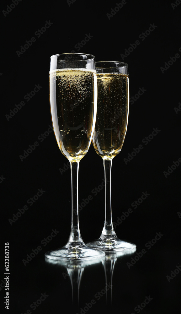 Glasses of champagne, on black background Glasses of champagne, on black background