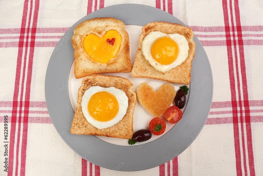 Scrambled eggs with bread on plate, on color napkin Scrambled eggs with bread on plate, on color napkin
