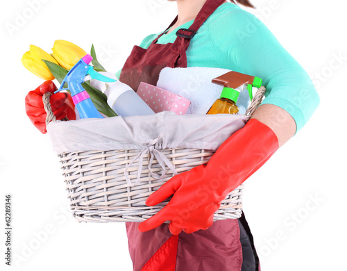Fototapeta Naklejka Na Ścianę i Meble -  Housewife holding basket with cleaning equipment. Conceptual