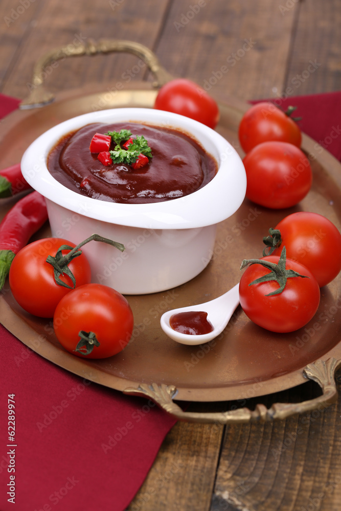 Tomato sauce in bowl on wooden table close-up Tomato sauce in bowl on wooden table close-up