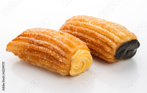 Cream Filled Churros and chocolate isolated on white photo