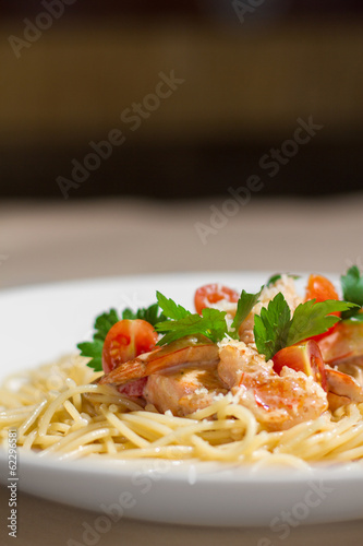 Image of tasty pasta with salmon and herbs