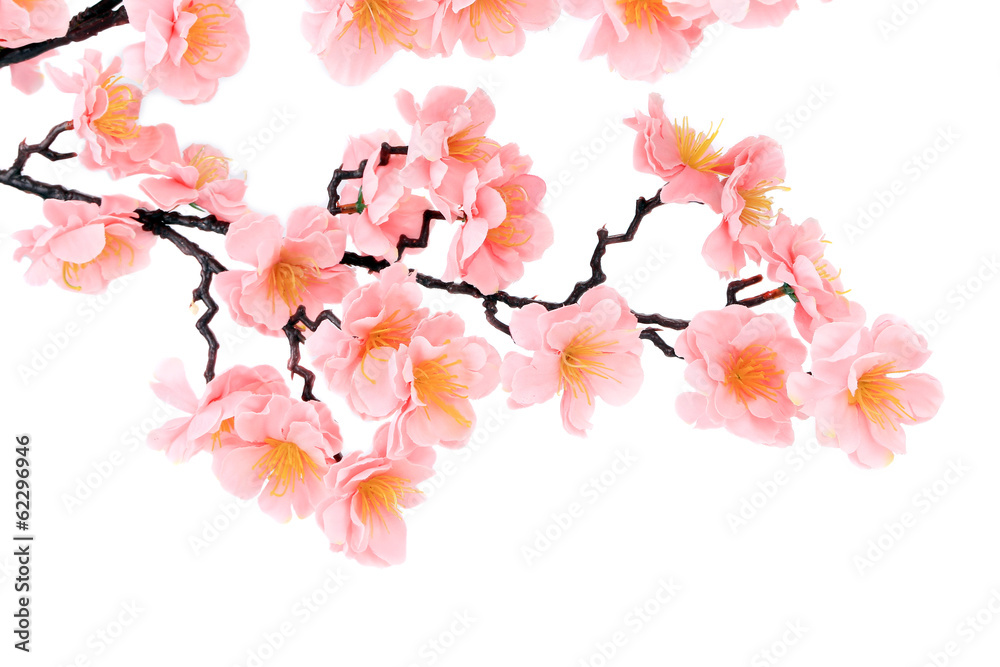 Branch of blooming artificial pink flowers.