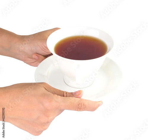 Female hands serving a cup of tea