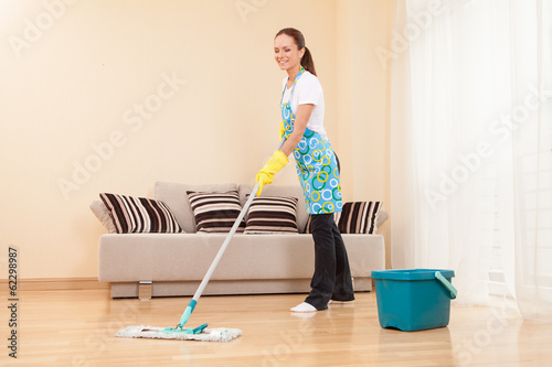 young woman doing housework and cleaning.