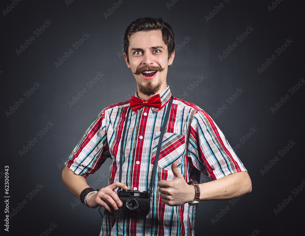 Portrait of a cheerful photographer in studio Portrait of a cheerful photographer in studio