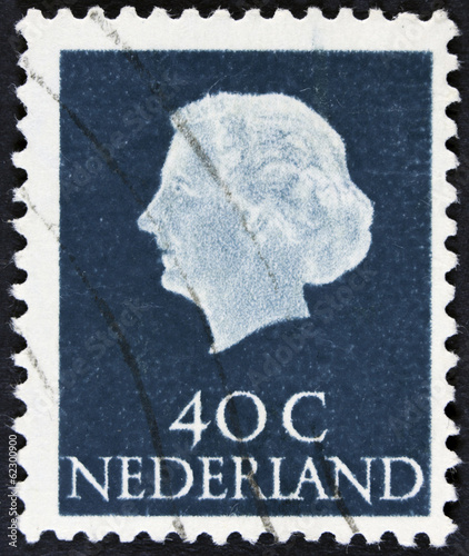 Stamp printed in the Netherlands shows Queen Juliana, circa 1953 photo