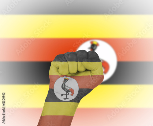 Fist wrapped in the flag of Uganda photo