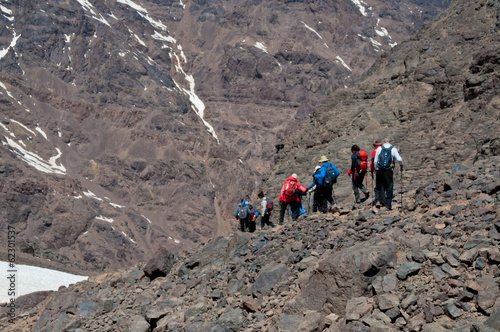 Group descending from summit of mountain