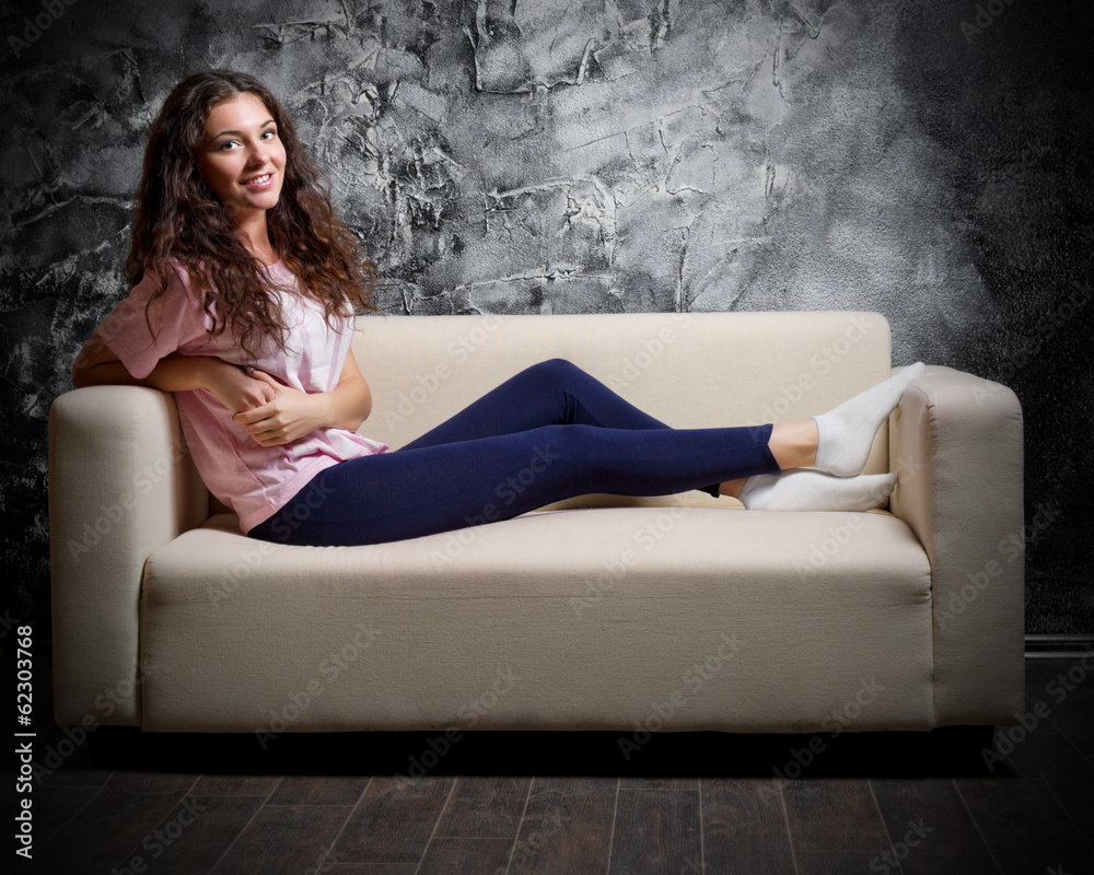 Fototapeta premium Young girl on sofa