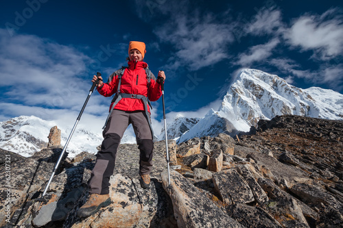 Hiker walks on train in Himalayas