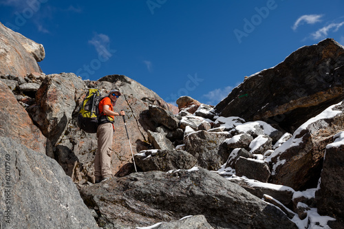 Hiker walks on train in Himalayas