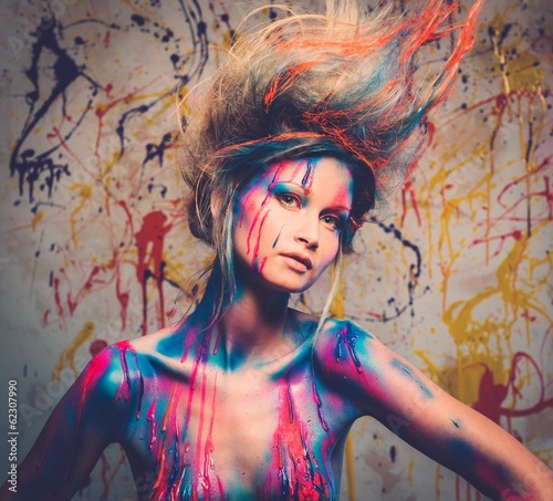 Woman muse with creative body art and hairdo