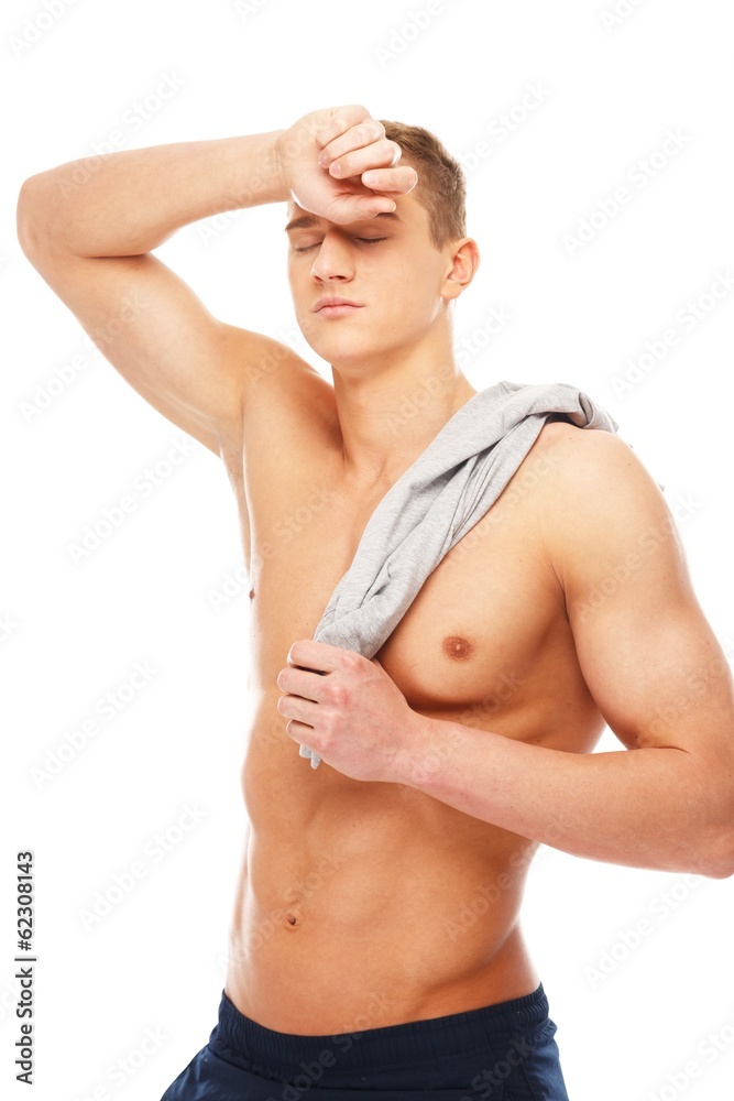 Tired handsome young man with muscular torso