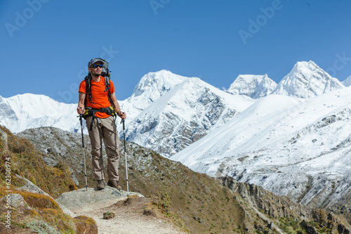 Hiker walks on train in Himalayas