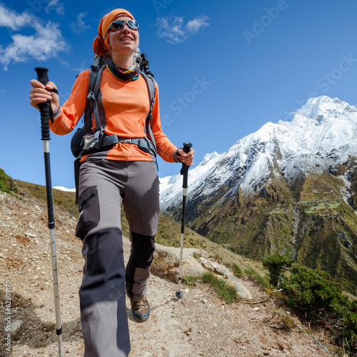 Hiker walks on train in Himalayas