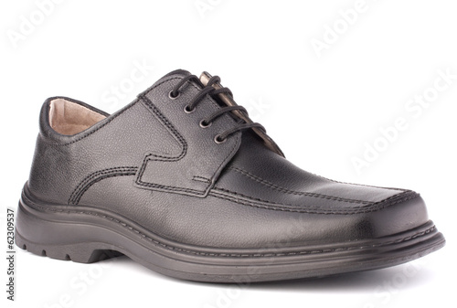 Black glossy man’s shoe with shoelaces