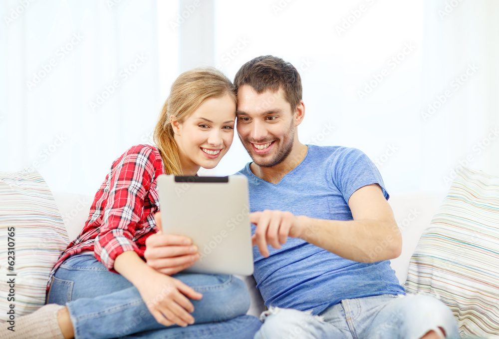 smiling couple with tablet pc computer at home smiling couple with tablet pc computer at home