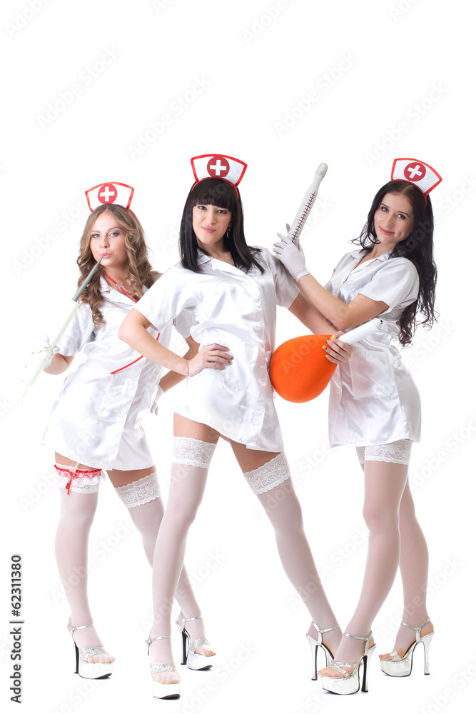 Trio of hot pretty girls posing in nurses suits Stock-foto | Adobe Stock