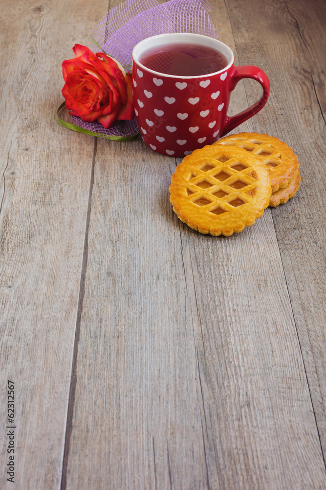 Tea cup and cookies over wooden table Tea cup and cookies over wooden table