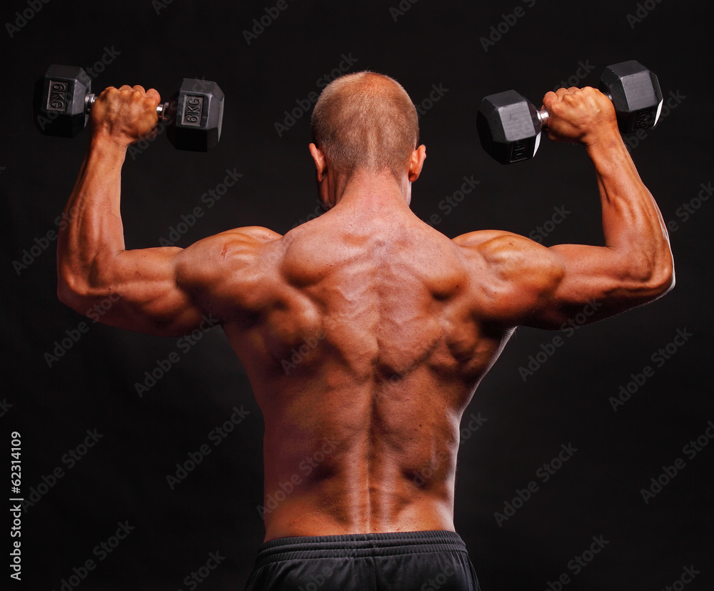 Muscular male bodybuilder posing in studio Muscular male bodybuilder posing in studio