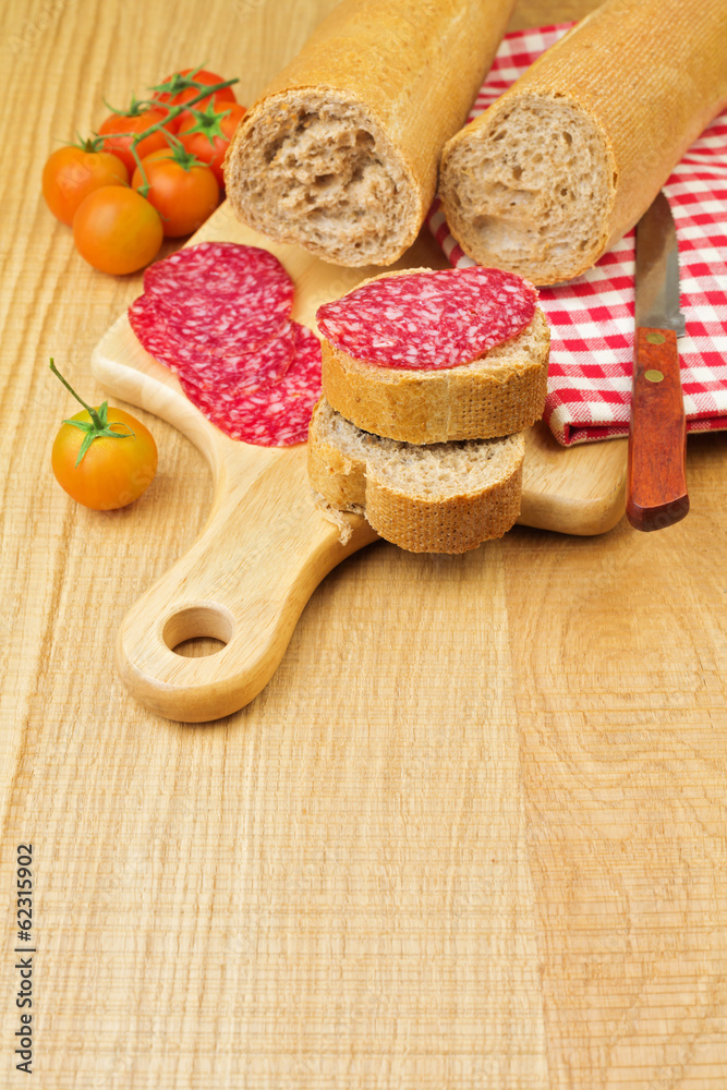 Sandwich with sliced meat sausage salami and tomatoes Sandwich with sliced meat sausage salami and tomatoes