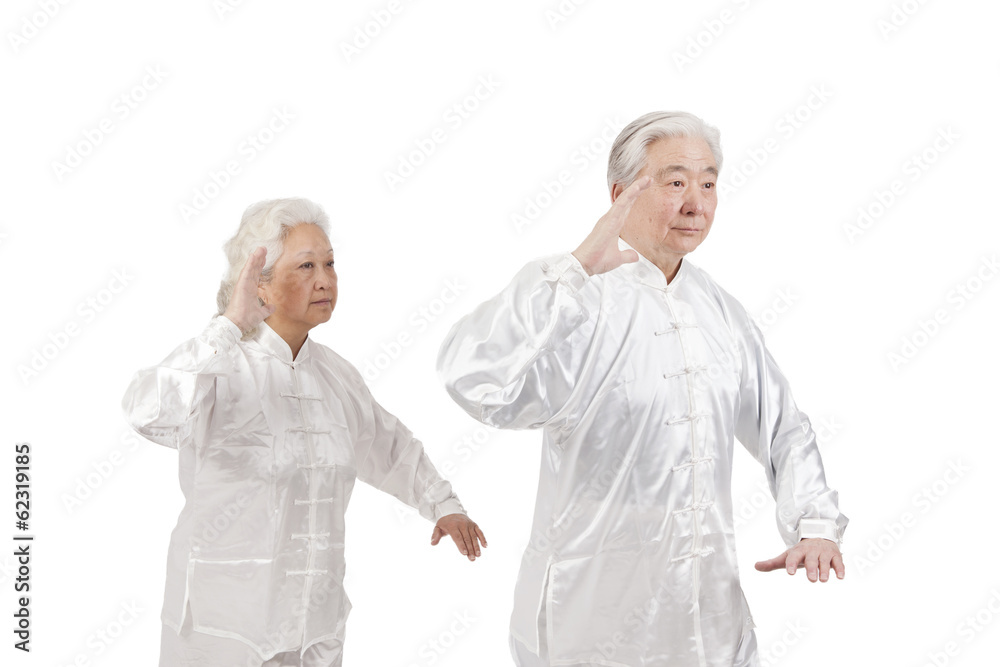 .Two senior people doing Tai Chi.