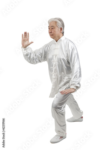 .Senior man doing Tai Chi.
