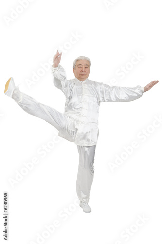 .Senior man doing Tai Chi.