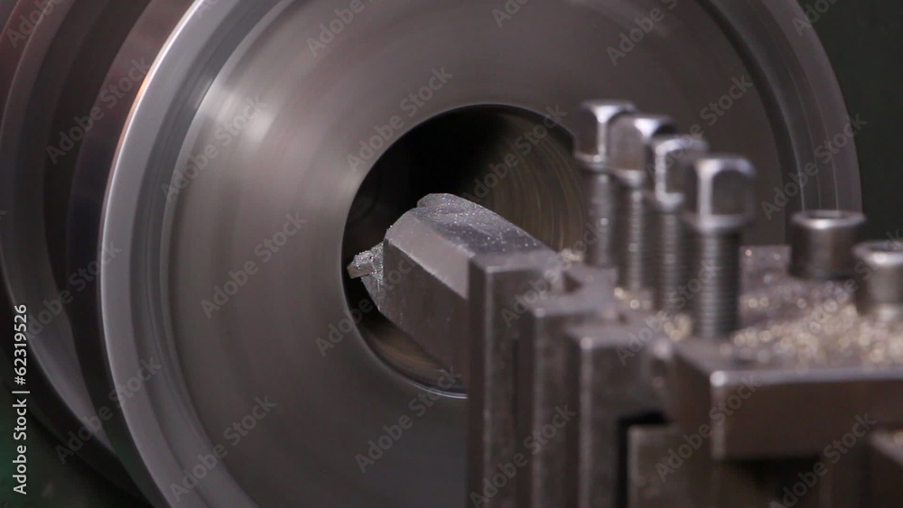 Heavy industry - processing steel on a lathe in factory