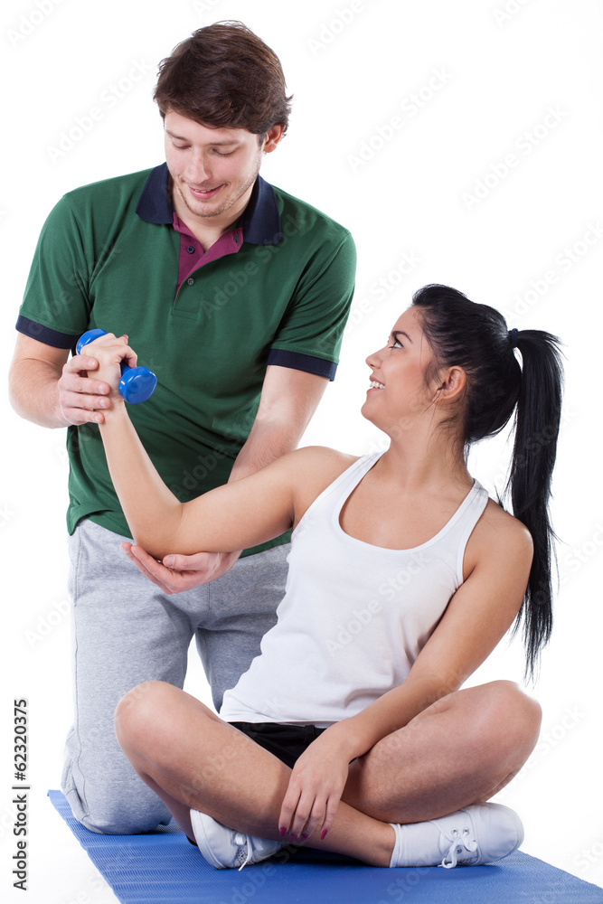Working on biceps with a trainer Working on biceps with a trainer