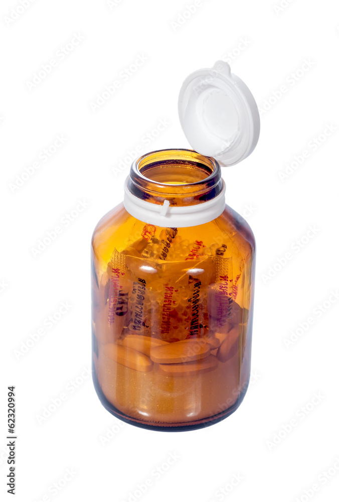open cap of vitamin bottle isolated on white open cap of vitamin bottle isolated on white