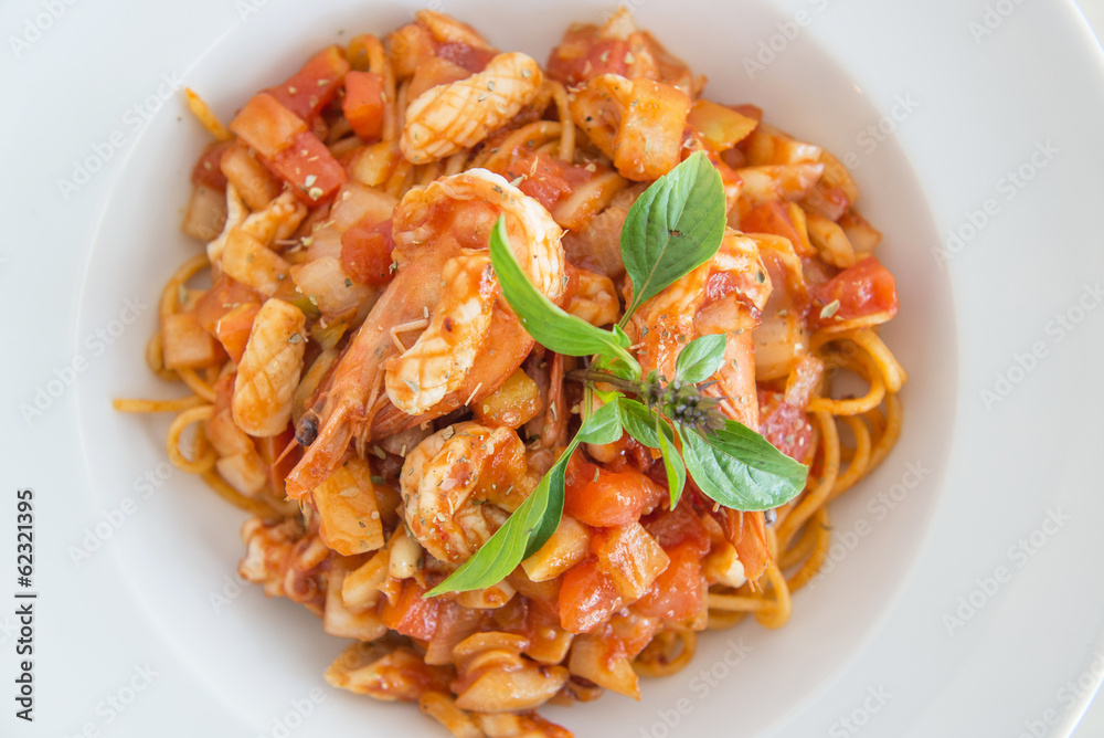 plate of spaghetti and tomato sauce and prawn plate of spaghetti and tomato sauce and prawn