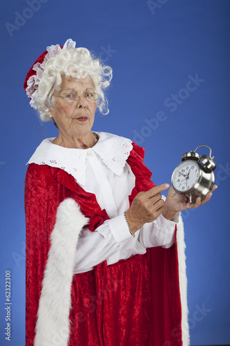 Mrs Claus showing Santa the time so he isn't late for Christmas