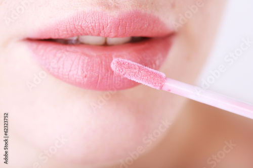 Beautiful make up of glamour pink gloss lips  close up