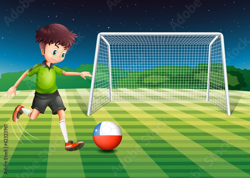 An athlete kicking the ball with the flag of Chile