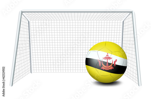 A soccer ball near the net with the Brunei flag