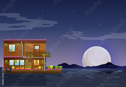 A boathouse floating in the middle of the night